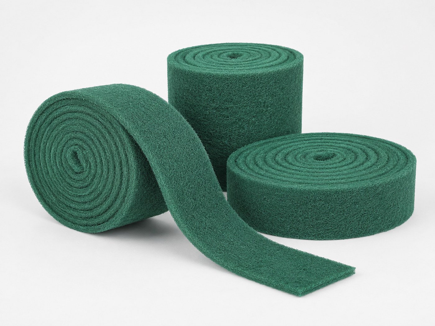 Green non-woven abrasive rolls