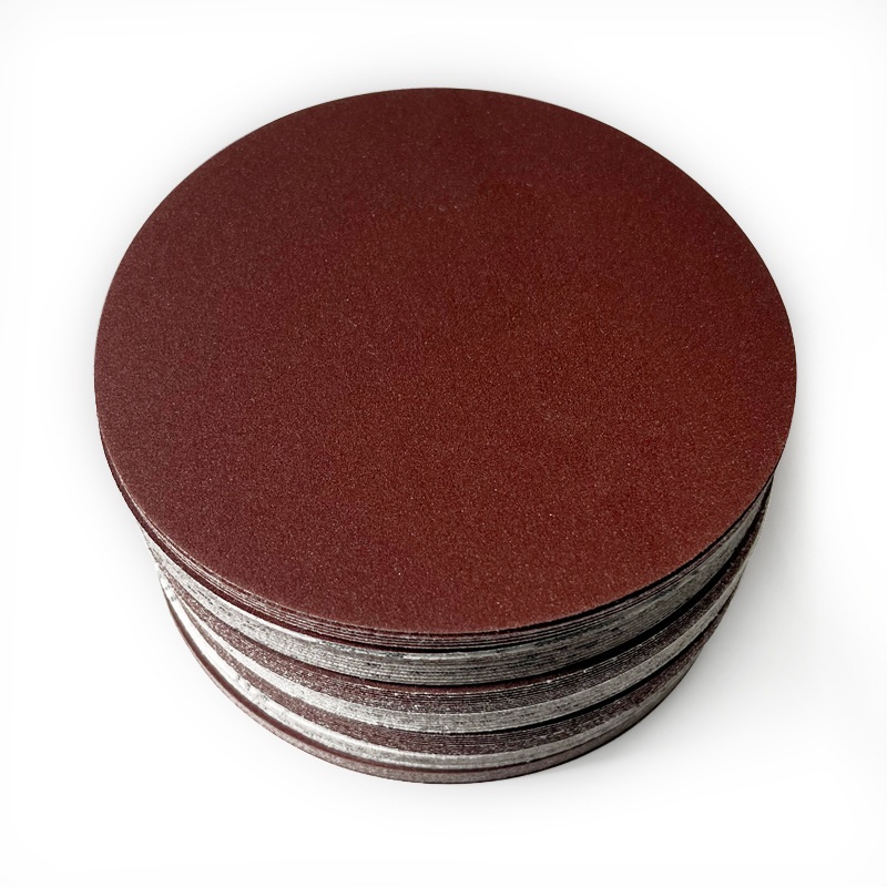 Stack of aluminum oxide hook-and-loop paper sanding discs