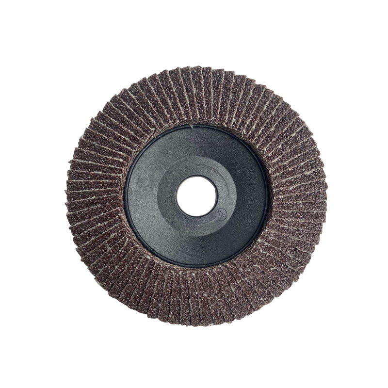 Front view of a 100 mm calcined aluminum oxide flap disc with plastic backing